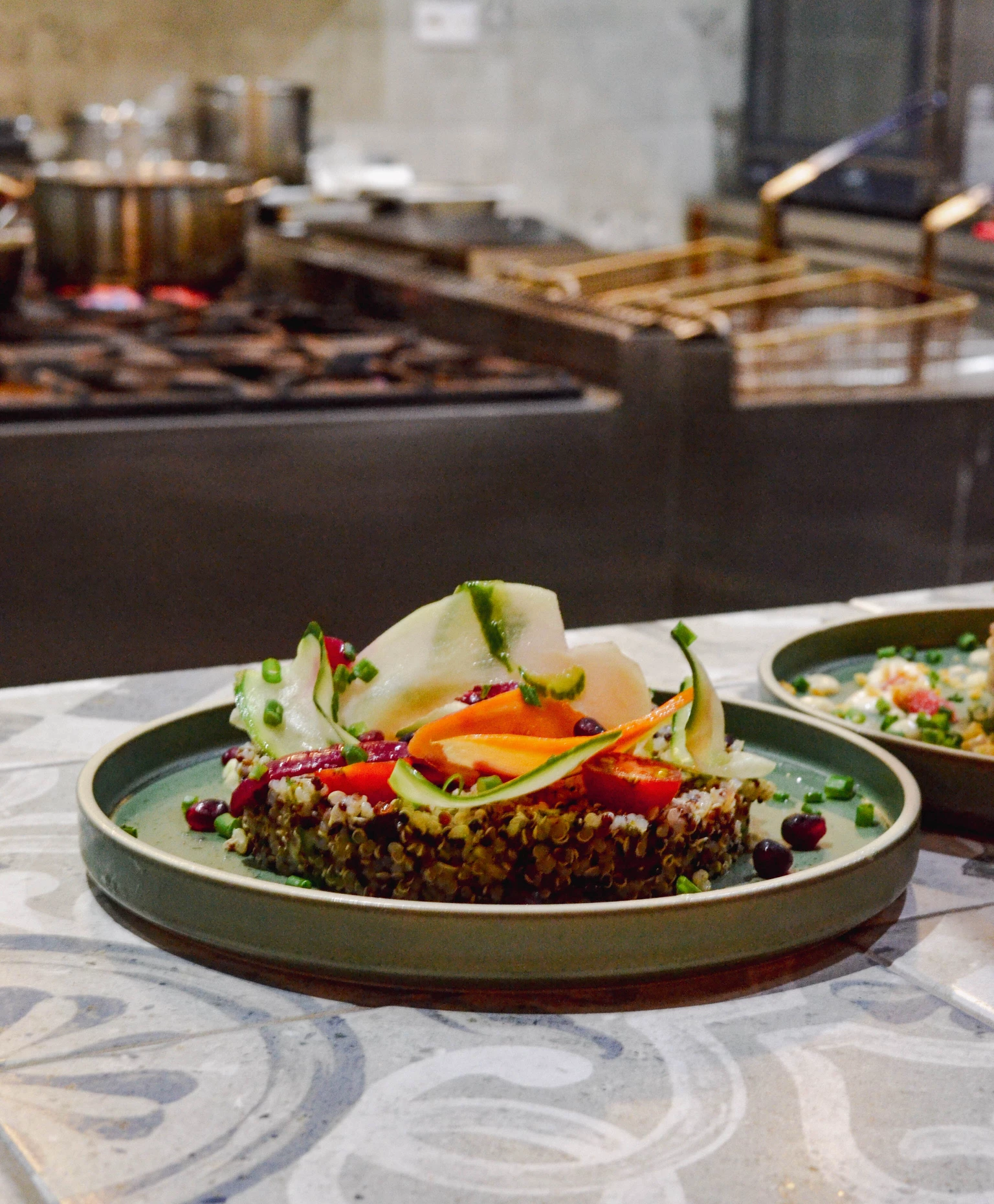 Gourmet quinoa salad with fresh vegetables and artistic plating at Wonders Beach 5-star hotel restaurant in Mauritius.